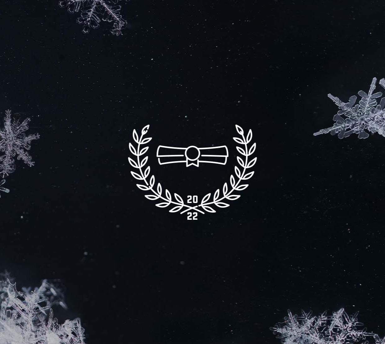 A laurel leaf icon with a scroll, surrounded by a border of snowflakes.