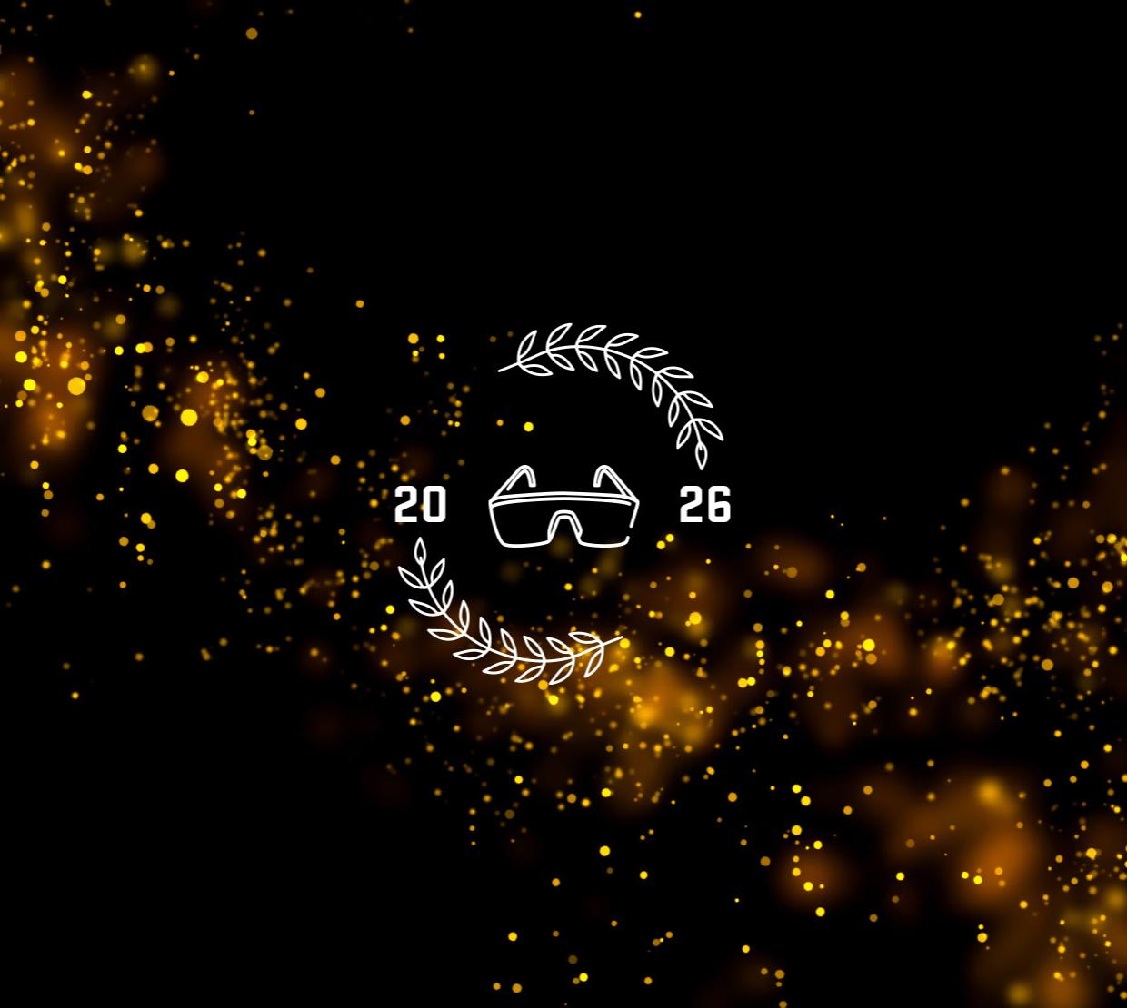 A black background with orange glitter and a pair of googles with the year 2026.
