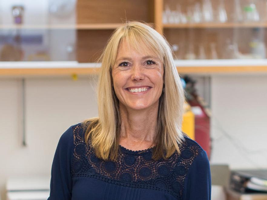 Dr. Kimberly Halsey standing in her lab.