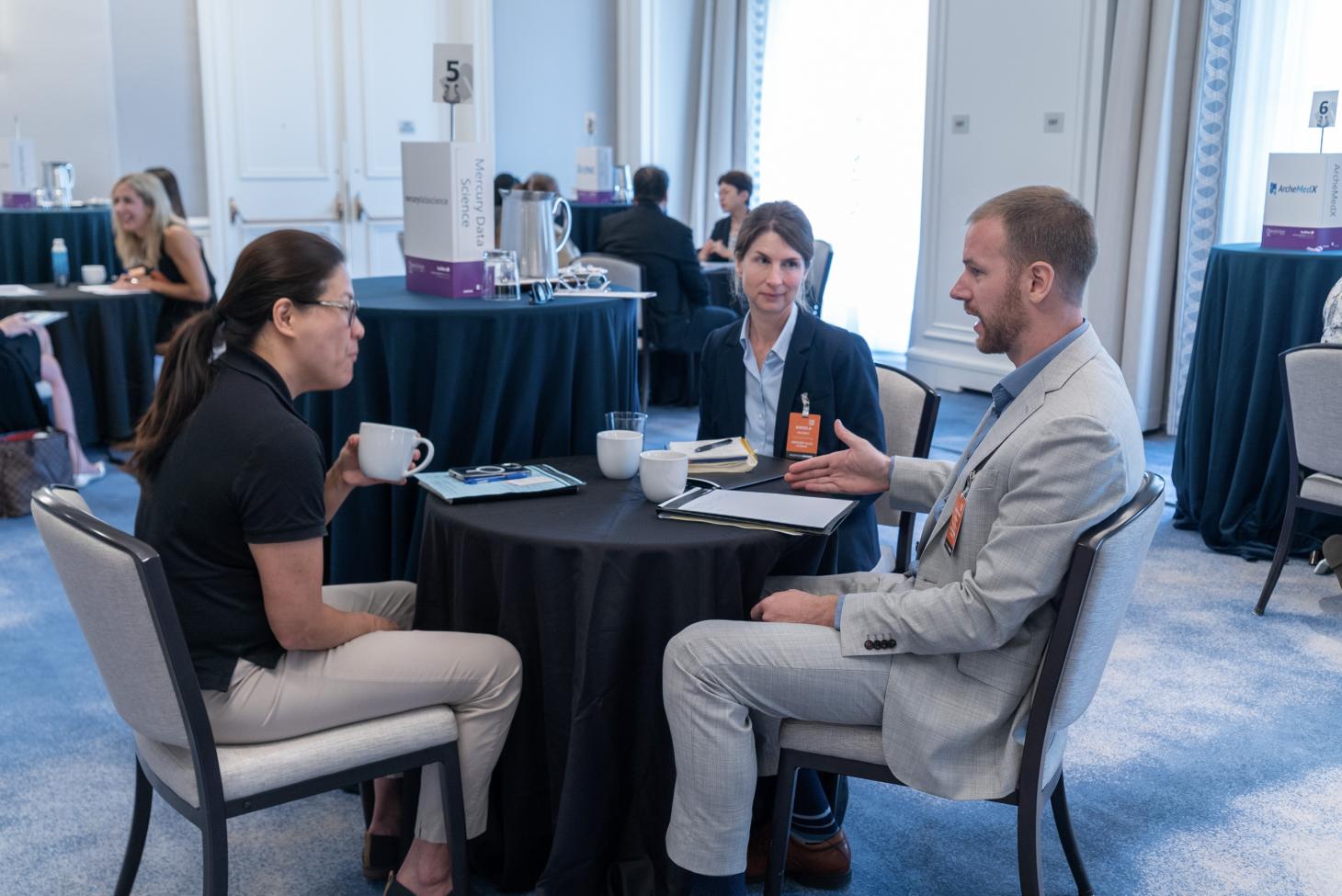 Jonathan Gallion at a table speaking with other industry leaders.