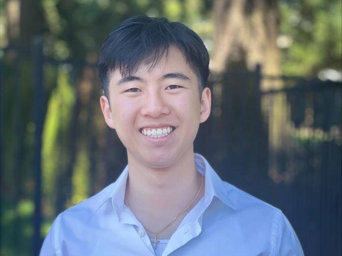 Headshot of Tyler Pham standing outside.