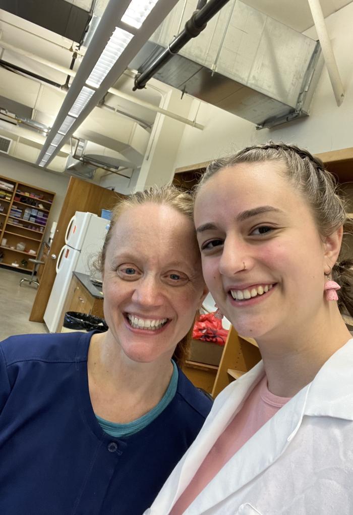 Noall and her advisor, Allison Evans, taking a selfie in a microbiology lab.